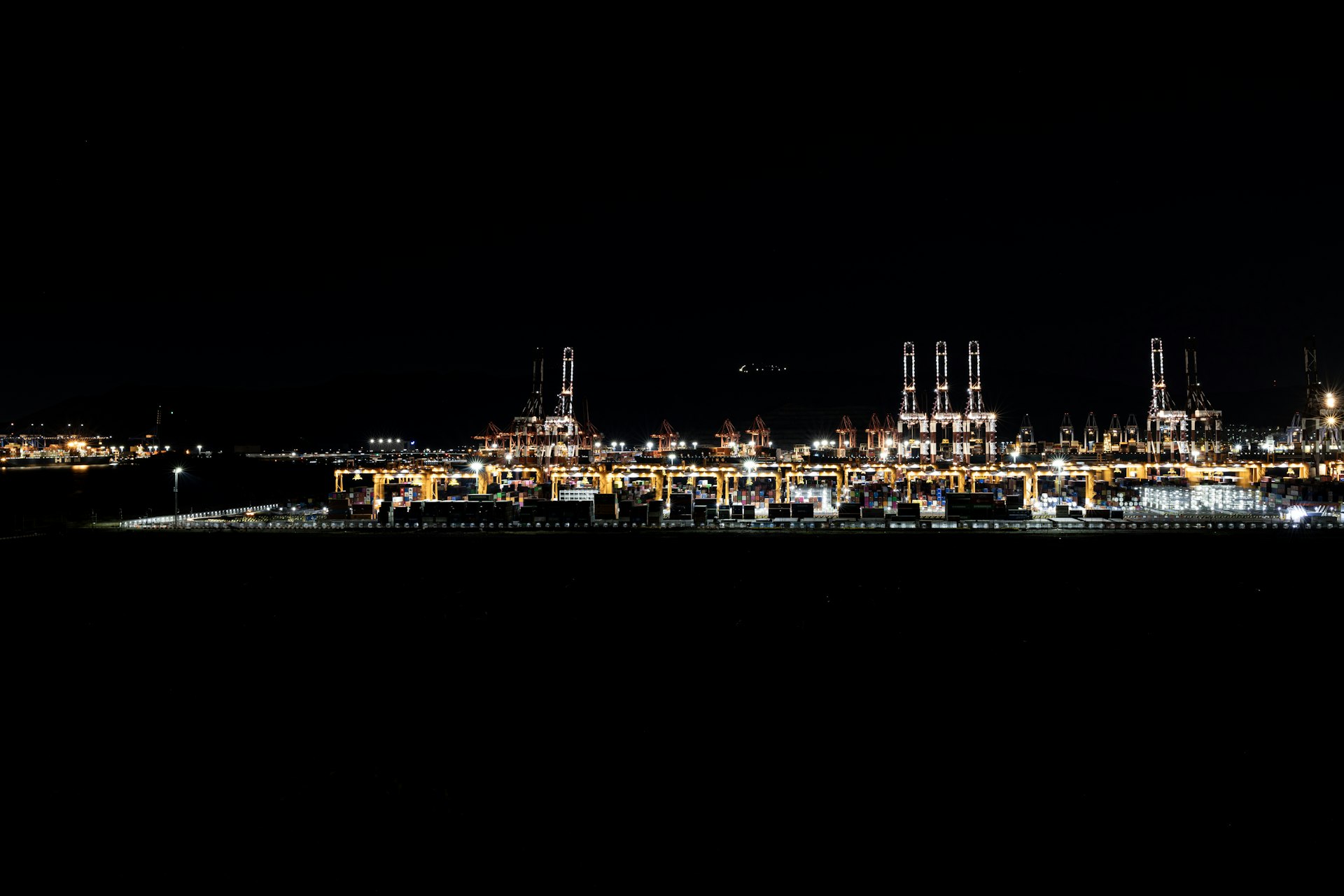 A city lit up at night in the dark